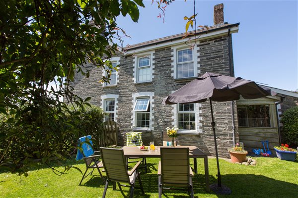 The exterior of the Farmhouse from the garden